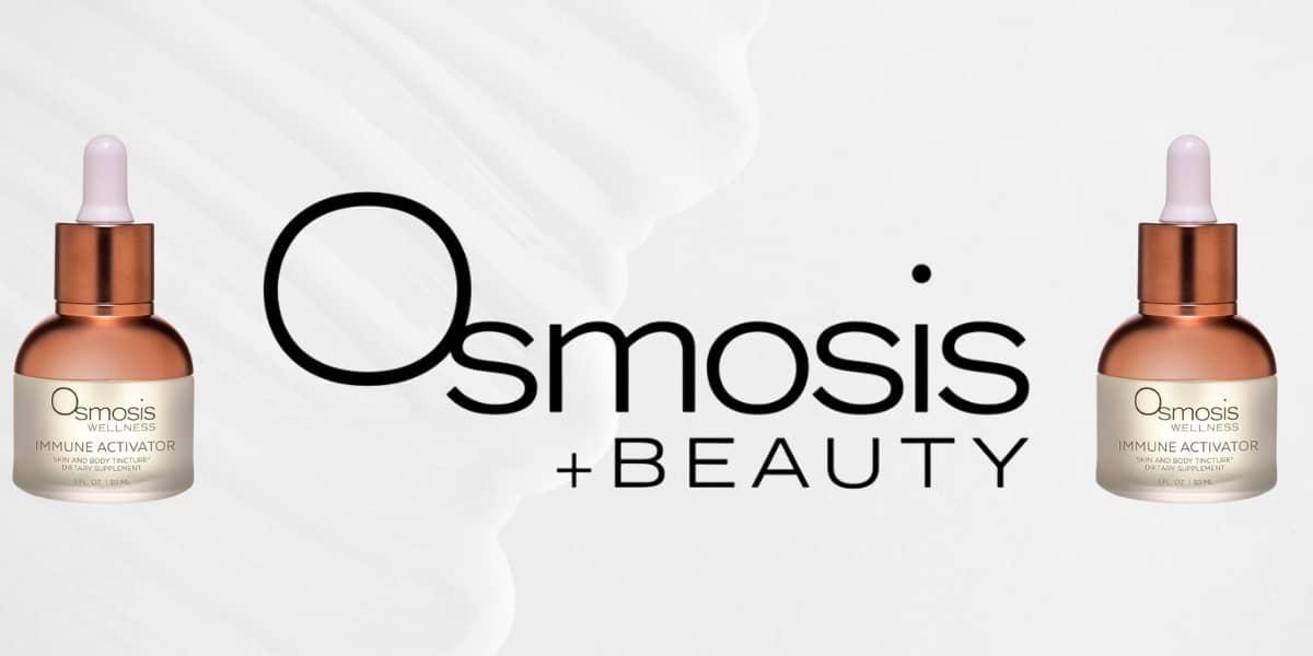 Close-up of Osmosis Rescue Serum bottle on skincare counter.