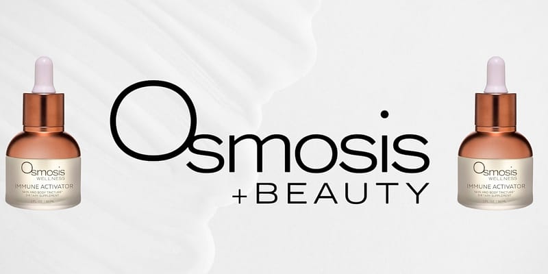 Close-up of Osmosis Rescue Serum bottle on skincare counter.